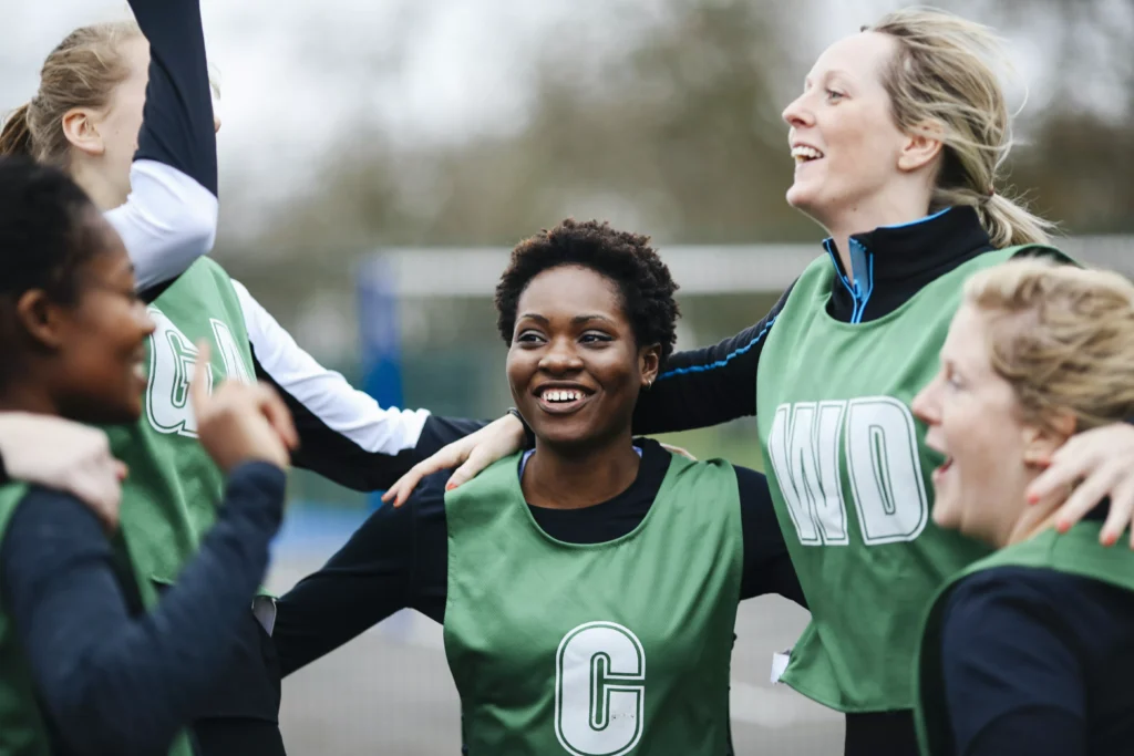 Sports coach supporting young athletes