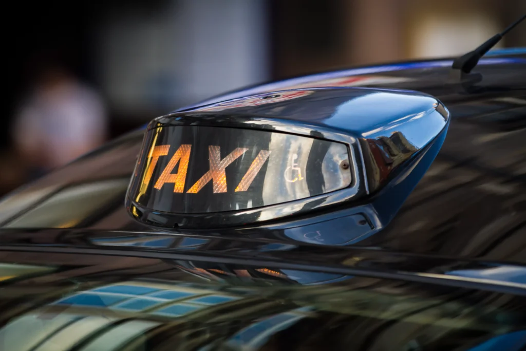 Taxi driver speaking with a passenger