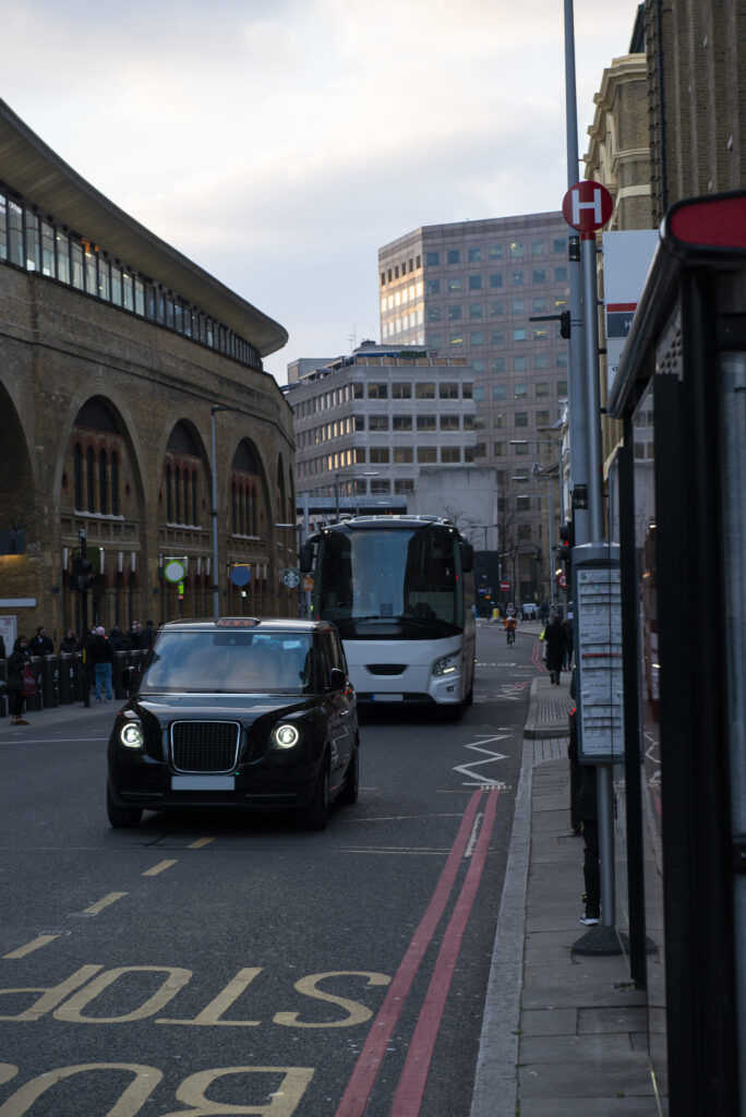 Traffic and taxis on a London street